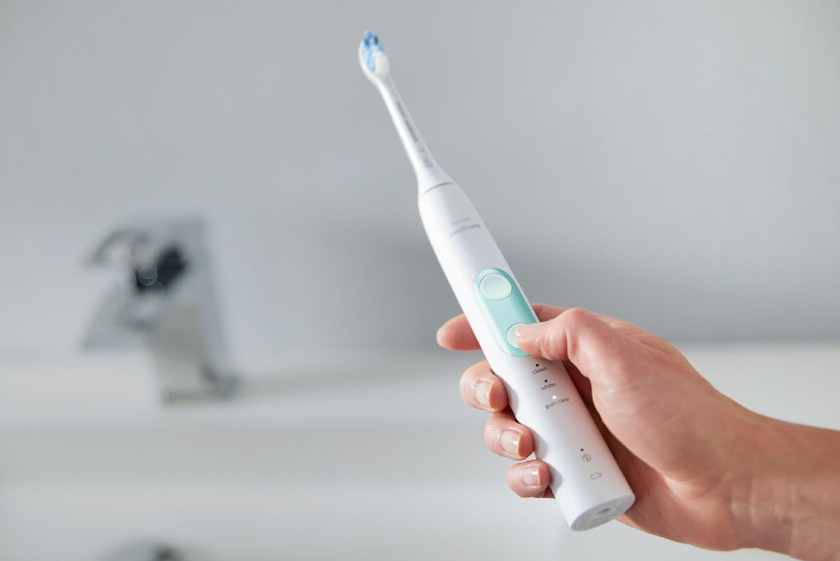 Philips Sonicare ProtectiveClean 5100 smart electric toothbrush on bathroom counter.